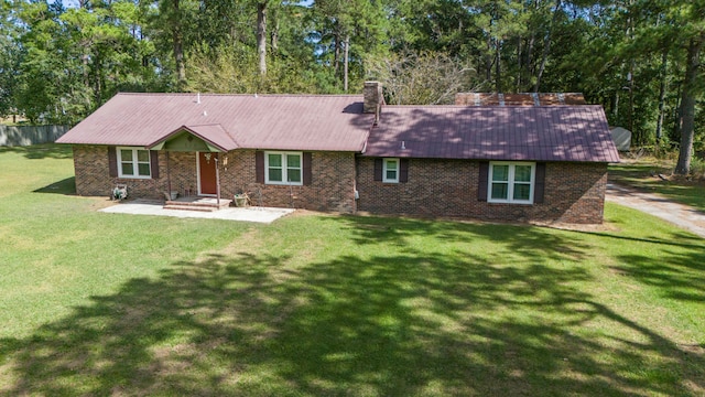 back of house featuring a yard