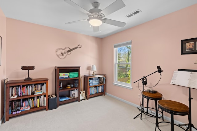 misc room with ceiling fan, carpet, visible vents, and baseboards