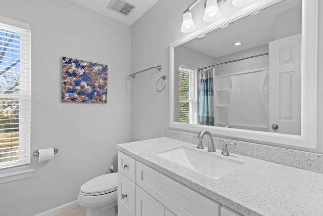 bathroom with curtained shower, visible vents, toilet, vanity, and baseboards