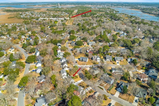 birds eye view of property featuring a water view and a residential view