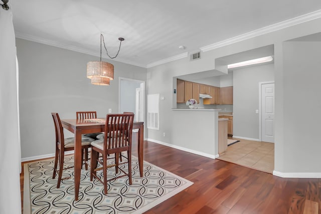 700 Daniel Ellis Dr Unit 3108, Charleston, SC 29412 - dining space with a chandelier, light wood-type flooring, and ornamental molding