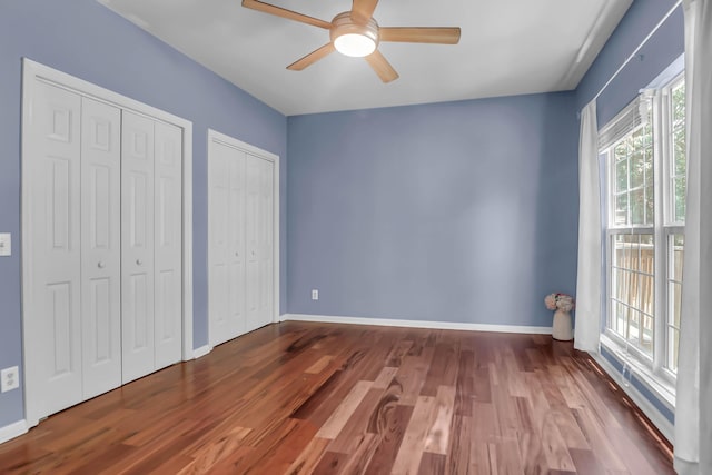 700 Daniel Ellis Dr Unit 3108, Charleston, SC 29412 - unfurnished bedroom with multiple closets, wood finished floors, and ceiling fan