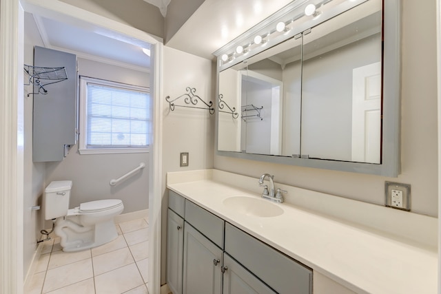 bathroom with vanity, crown molding, toilet, and tile patterned floors