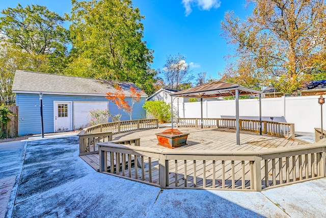 wooden deck featuring a gazebo and a patio area