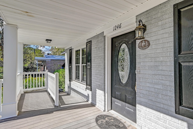 doorway to property with a porch