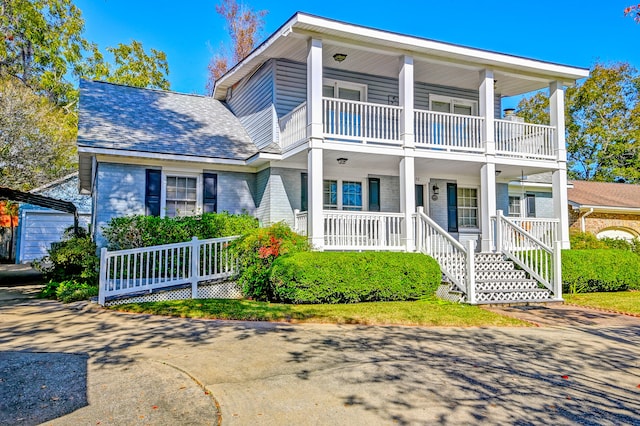 view of front of house featuring a balcony and covered porch