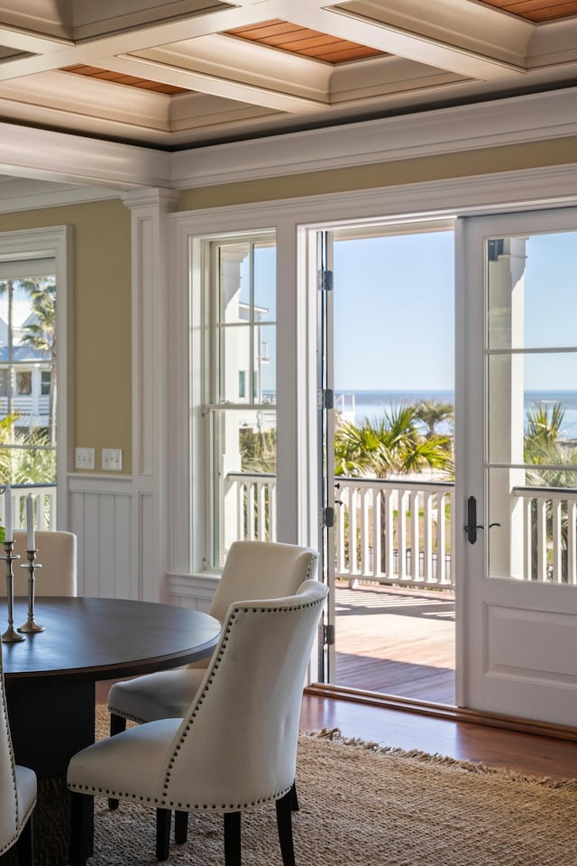 interior space featuring coffered ceiling and wood finished floors