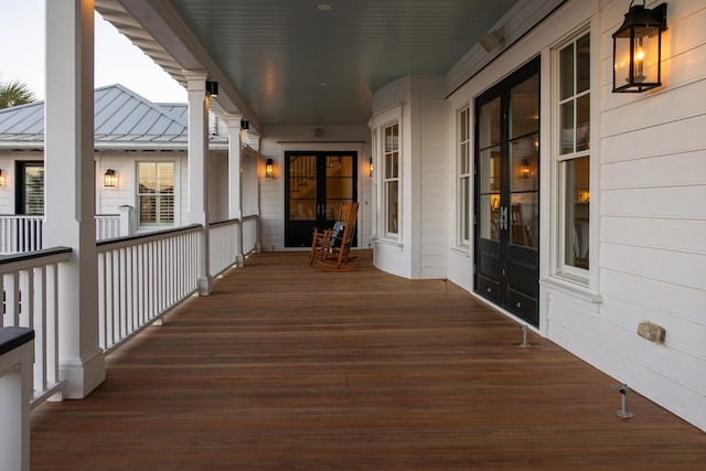 deck with a porch and french doors