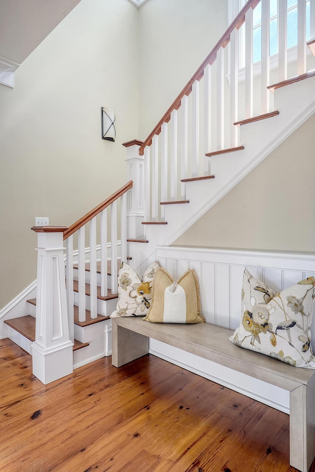 staircase with hardwood / wood-style floors