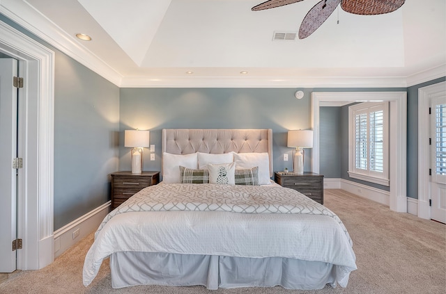 bedroom featuring carpet, visible vents, a raised ceiling, and baseboards