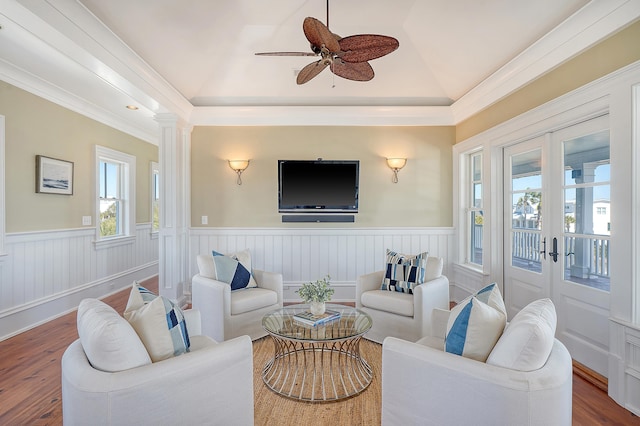 living room with french doors, wood finished floors, and wainscoting