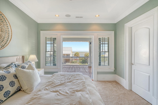 bedroom with carpet floors, crown molding, visible vents, access to outside, and baseboards