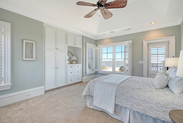 bedroom featuring lofted ceiling, light carpet, visible vents, a ceiling fan, and ornamental molding