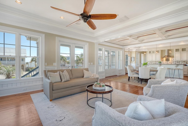 sunroom / solarium featuring coffered ceiling, plenty of natural light, visible vents, and beamed ceiling