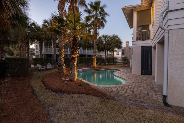 view of pool featuring fence, a fenced in pool, and a patio