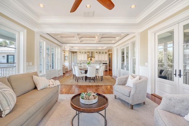 sunroom / solarium featuring coffered ceiling, french doors, a healthy amount of sunlight, and beamed ceiling