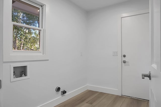 washroom featuring light hardwood / wood-style floors and hookup for a washing machine