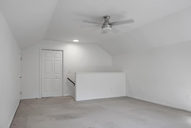 additional living space featuring lofted ceiling and ceiling fan