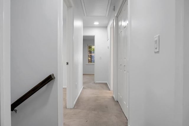 corridor featuring light colored carpet