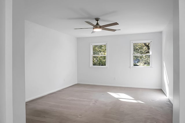 spare room with ceiling fan