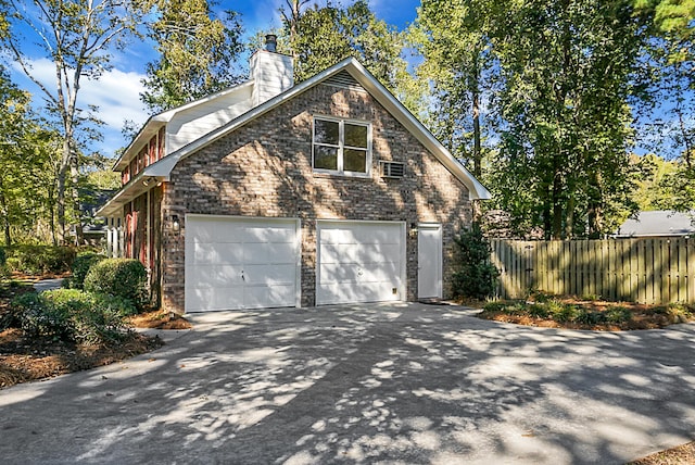 view of side of property featuring a garage