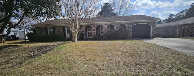 ranch-style house with a garage and a front yard