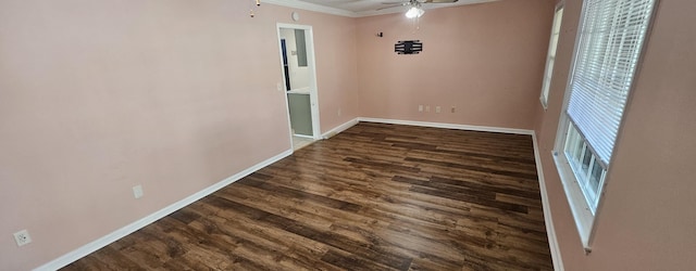 empty room featuring crown molding, ceiling fan, and dark hardwood / wood-style flooring