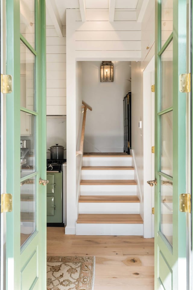 stairway featuring wood finished floors