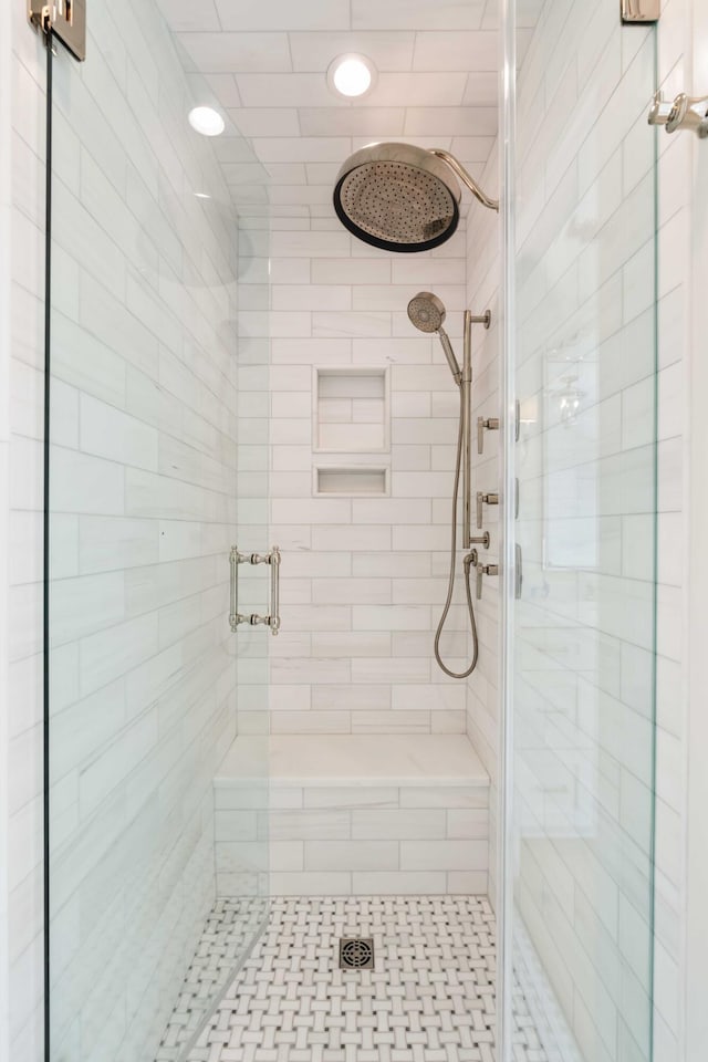 full bathroom with a stall shower and recessed lighting