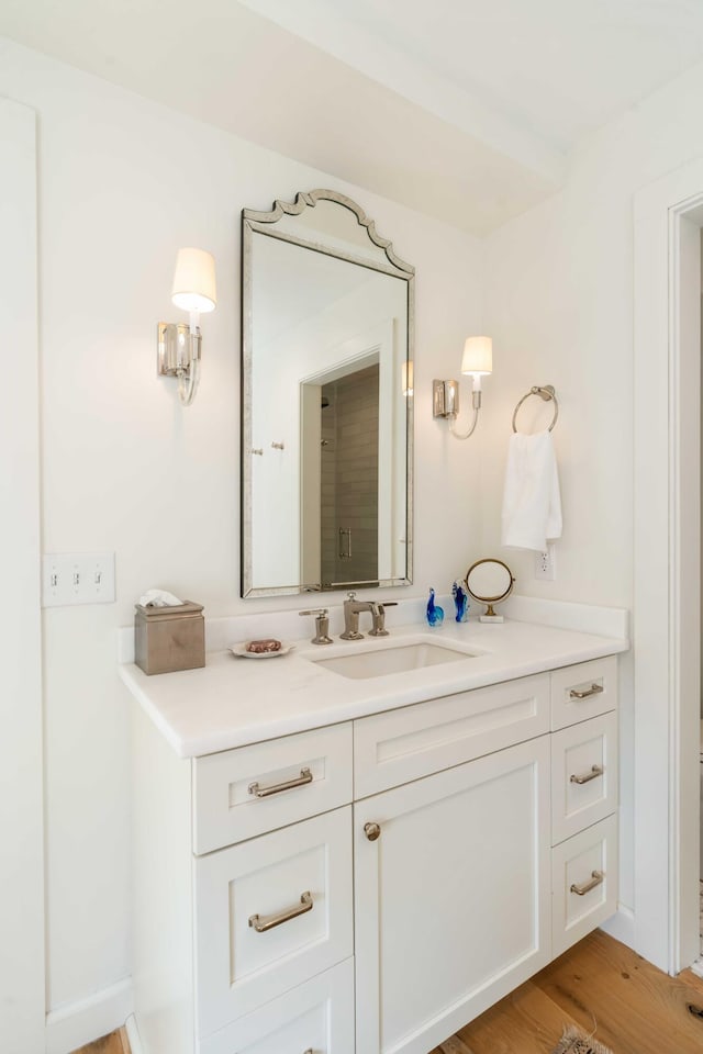 bathroom featuring vanity and wood finished floors
