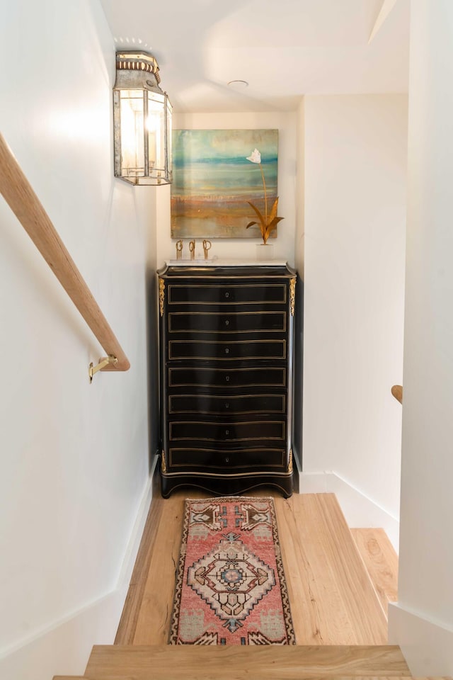 interior space with baseboards and wood finished floors