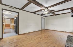 unfurnished room featuring ceiling fan, beam ceiling, wood-type flooring, and coffered ceiling