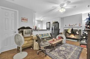 interior space with hardwood / wood-style flooring and ceiling fan