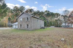 view of side of property with a garage