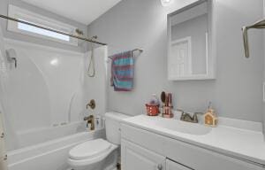 full bathroom with vanity,  shower combination, and toilet