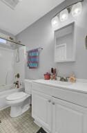 full bathroom with shower / bathing tub combination, vanity, and toilet