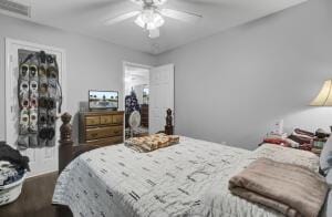 bedroom featuring ceiling fan and dark hardwood / wood-style flooring