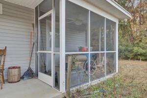 view of side of property featuring a sunroom