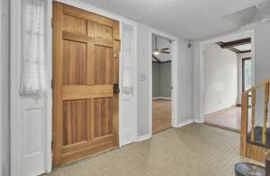 interior space with ceiling fan