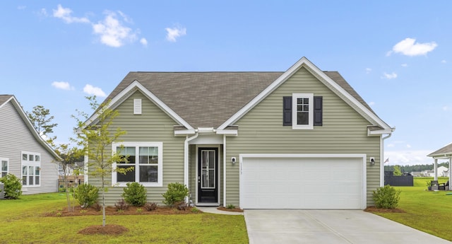 1173 Wading Point Blvd, Huger, SC 29450 - traditional-style house featuring concrete driveway, a front lawn, a garage, and roof with shingles