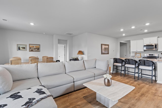 1173 Wading Point Blvd, Huger, SC 29450 - living area with recessed lighting and light wood-type flooring