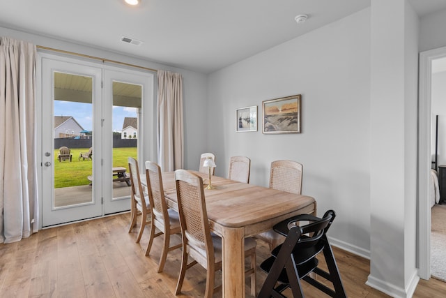 1173 Wading Point Blvd, Huger, SC 29450 - dining room with light wood-style floors and baseboards