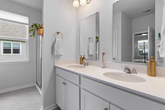 1173 Wading Point Blvd, Huger, SC 29450 - full bath with healthy amount of natural light, baseboards, double vanity, and tile patterned floors