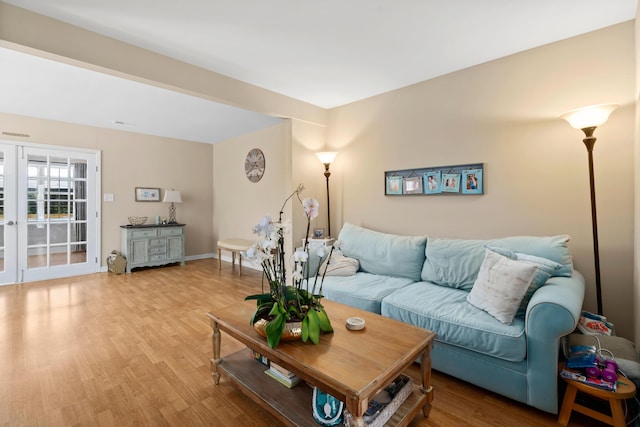 living room with light hardwood / wood-style flooring