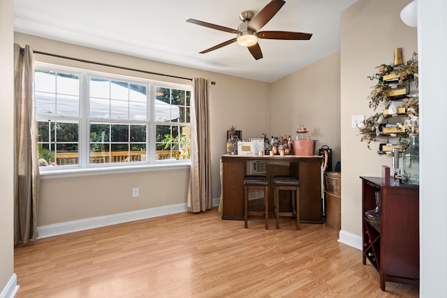 office area with ceiling fan and light hardwood / wood-style floors