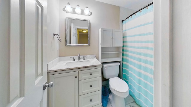 bathroom with vanity, toilet, and curtained shower