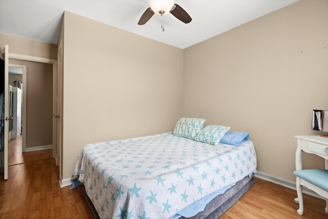 bedroom featuring wood-type flooring and ceiling fan