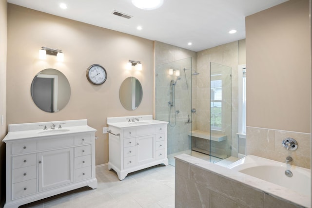 bathroom with vanity and separate shower and tub