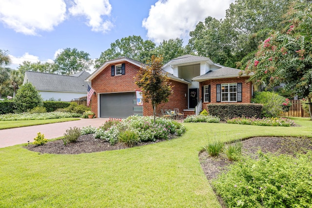 view of front of property with a garage and a front yard