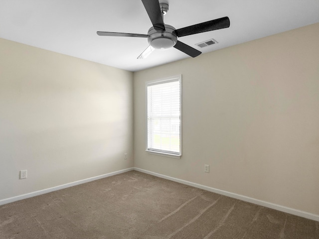 carpeted empty room with ceiling fan